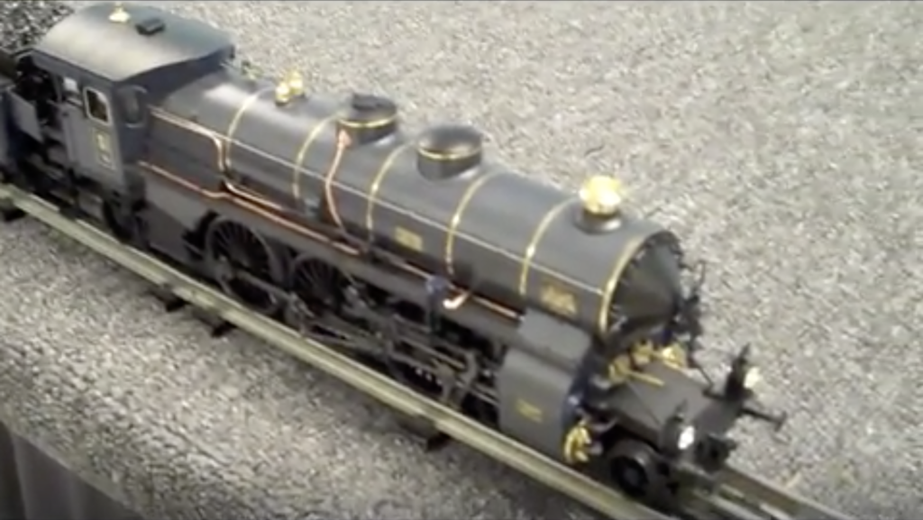 Close view of a Bavarian-style toy train steam locomotive.