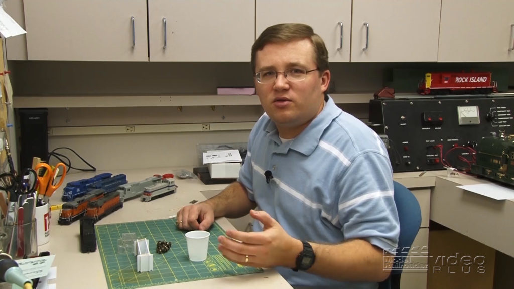 Cody Grivno sitting at his workbench