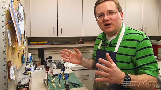 Cody Grivno standing at his workbench