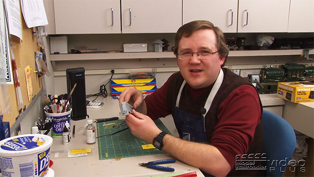 Cody Grivno sitting at his workbench