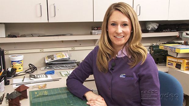 Jenny Freeland sitting at Cody's workbench