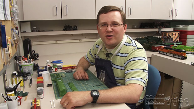 Cody Grivno sitting at his workbench