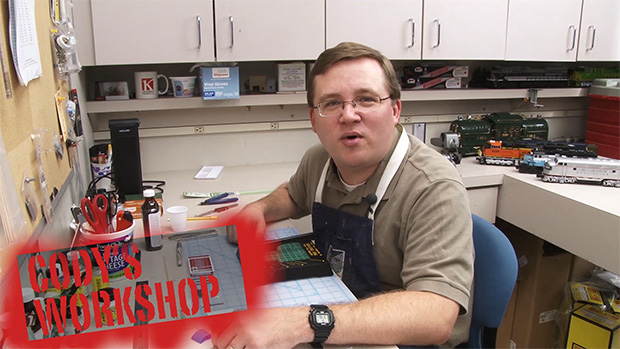 Cody Grivno sitting at his workbench