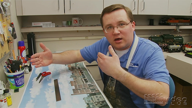 Cody Grivno sitting at his workbench introducing a project