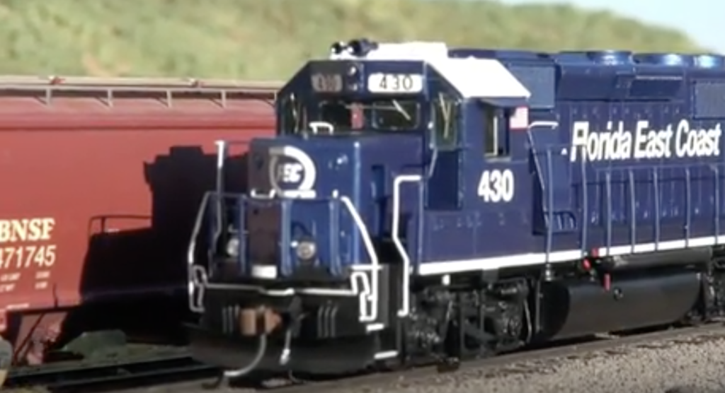 Blue painted model locomotive.