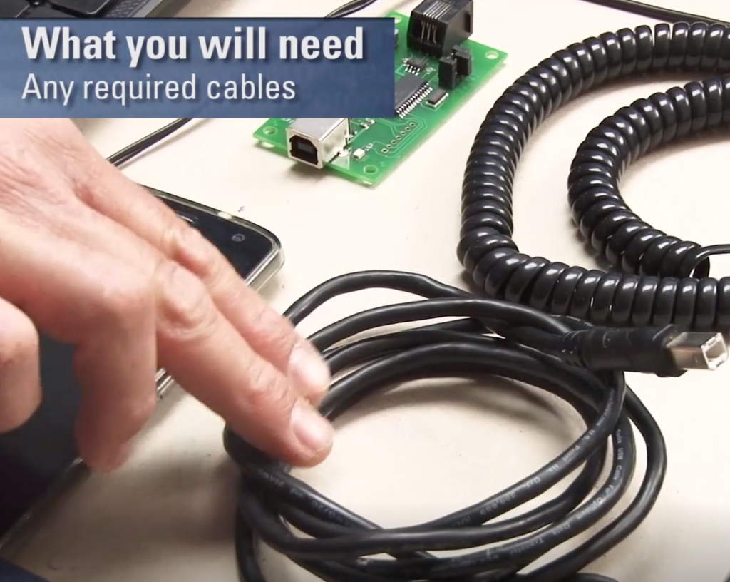 "What you will need; Any required cables" label with fingers touching cables.