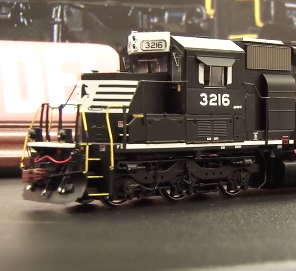 Front section and cab of a black-painted model train locomotive.