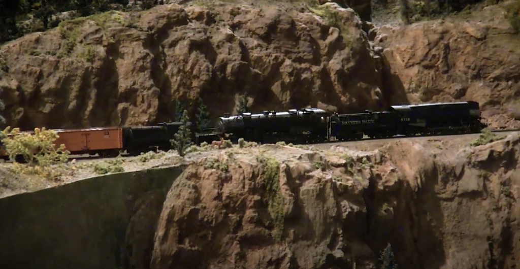 Southern Pacific freight train with two cab forwards and a 4-8-2 Mountain operating during Old West Days at the Colorado Model Railroad Museum