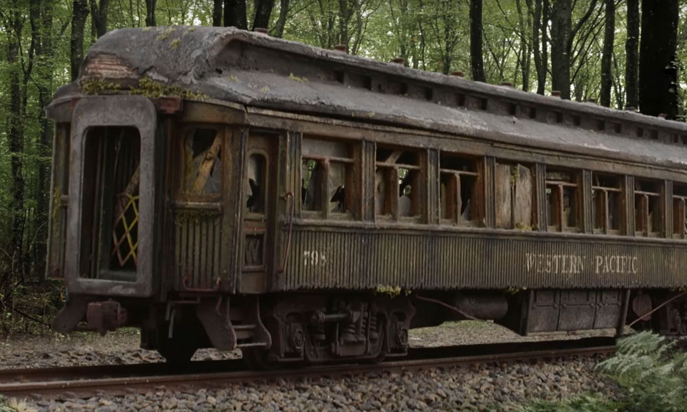 Weathered model passenger car