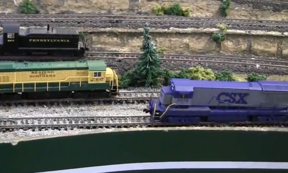 Two model locomotives on a train layout