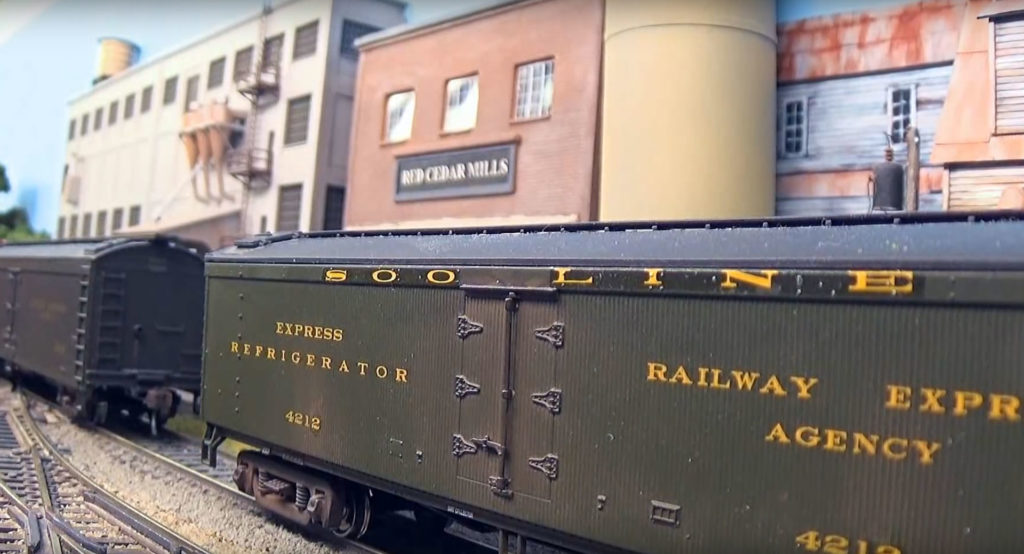 Model mail cars on model railroad