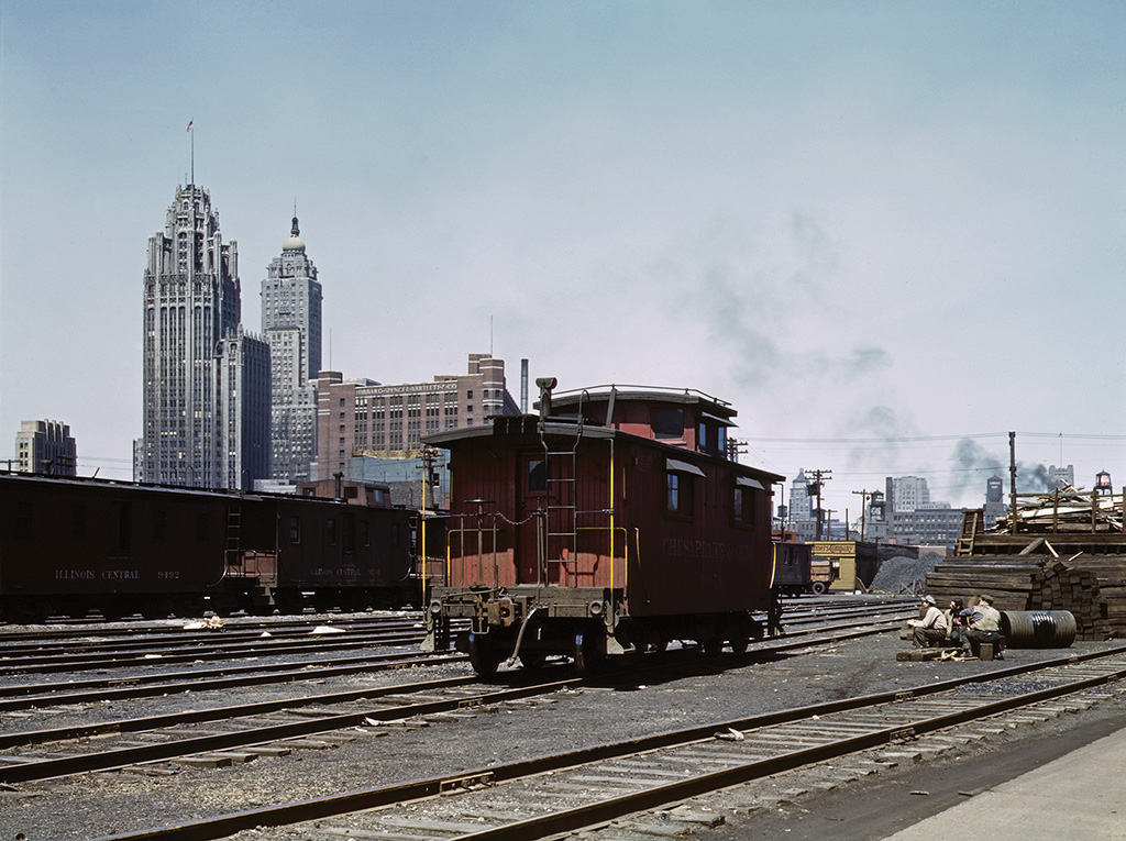 Red caboose sitting in railroad yard. Five mind-blowing facts — Cabooses.