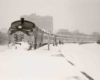 Passenger train on curve in snow