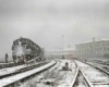 Passenger train in station with heavy snow