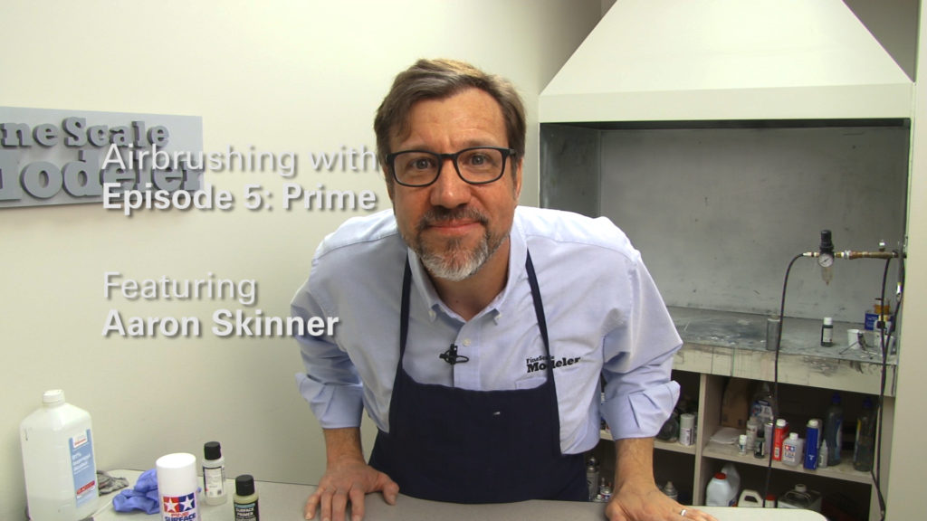 Aaron Skinner in an airbrushing studio.