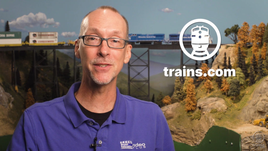 David Popp next to trains.com logo