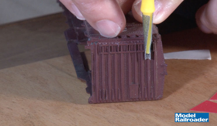 Hand using a cone tip sander