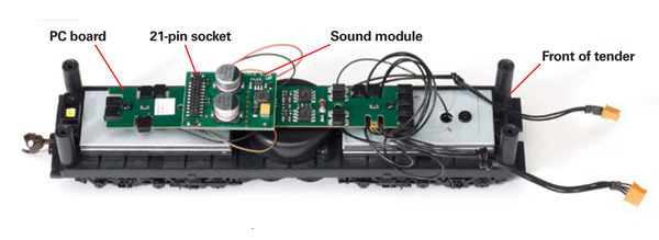 The SoundTraxx sound module sold separately fits onto a 21-pin plug on the printed circuit board inside the tender