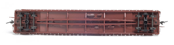 The simulated cast-steel underframe has a center pocket that holds a heavy sheet-steel weight tight against the deck