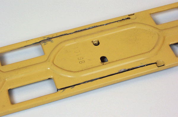 yellow metal base of toy train
