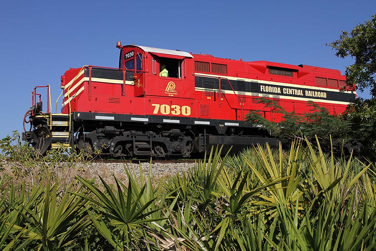 Side view of red and black Florida Central locomotive