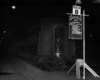 Passenger train in stub end station at night