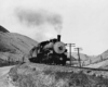 Steam locomotive on curve in hills