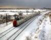 a passenger train on a snowy landscape