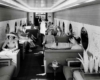 People sit inside railroad lounge car