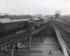 a passenger train on an overpass