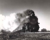 a steam engine bellowing a huge plume of steam