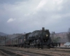 Steam hauled passenger train at station