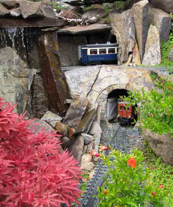 rocks with red plants and caboose: Hardiness Zones