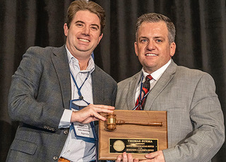 New MARS President Stefan Loeb, left, is congratulated by outgoing president Tom Surma, who was honored for his leadership at the 2020 Winter Meeting in January.