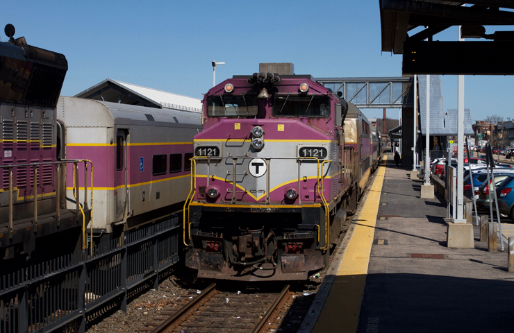 Purple and silver MBTA train at station. MBTA is unsafe and service isn't great either, says poll.