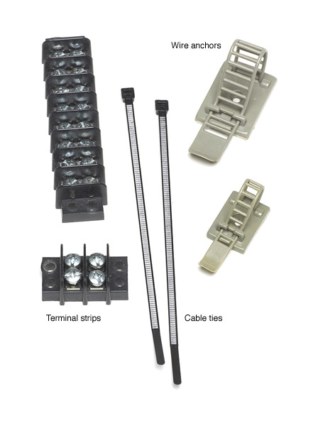 Fig. 2. Wiring aids. Items such as terminal barriers, cable ties, and wire anchors help keep wiring under the layout organized.