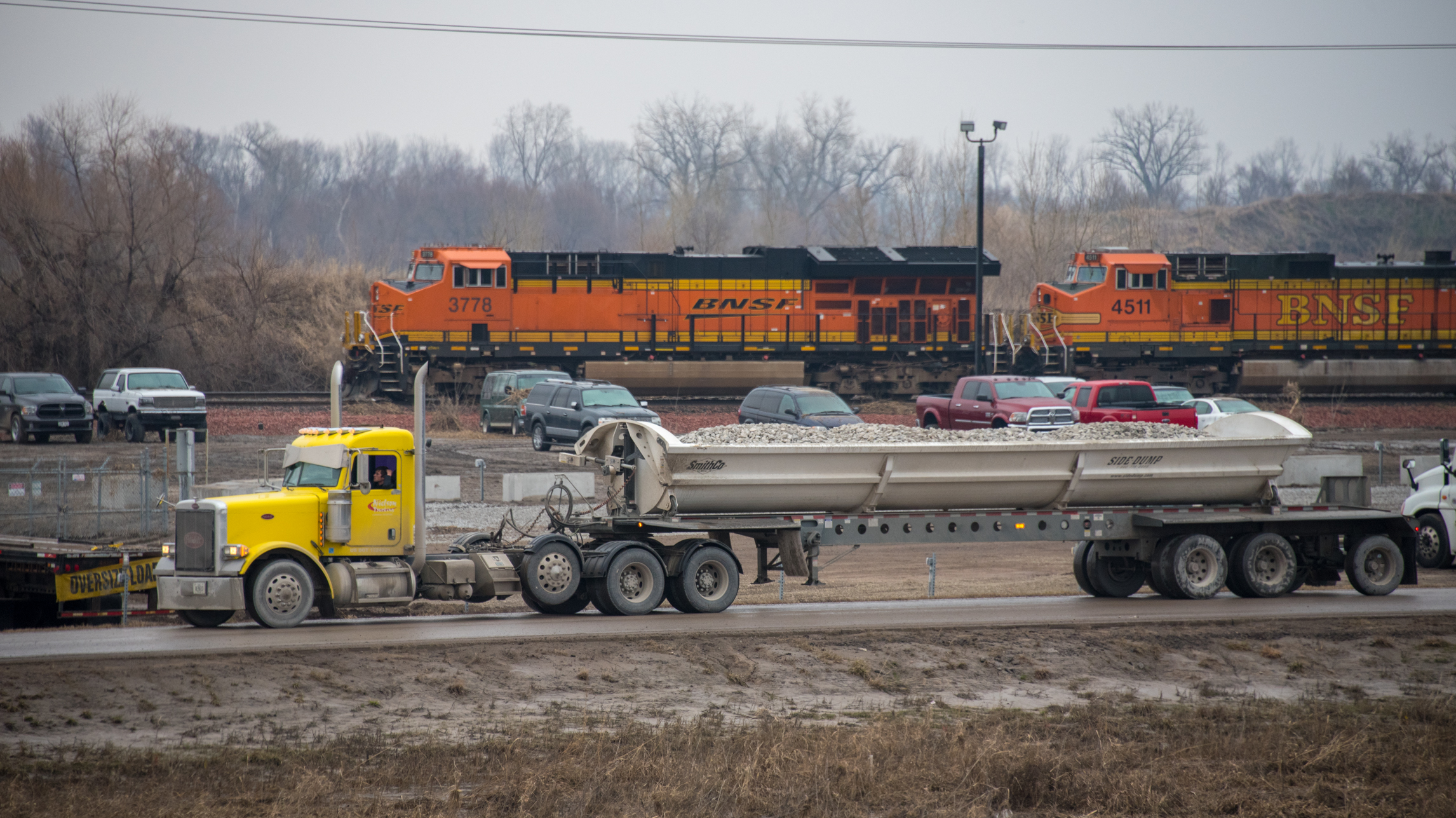 Three truckloads of rock are being dumped on the southern approach to the BNSF Omaha subdivision