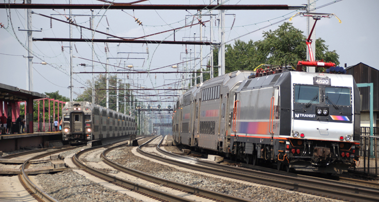 Two trains meet on curve of four-track electrified main line