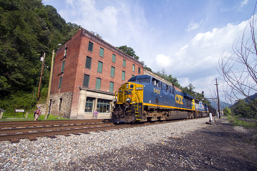 A westbound CSX freight skirts the storefronts in downtown Thurmond, W.Va., in the heart of the New River Gorge. 