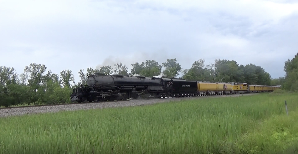 Union Pacific Big Boy 4-8-8-4 steam locomotive on grassy flat lands near Omaha, Neb.