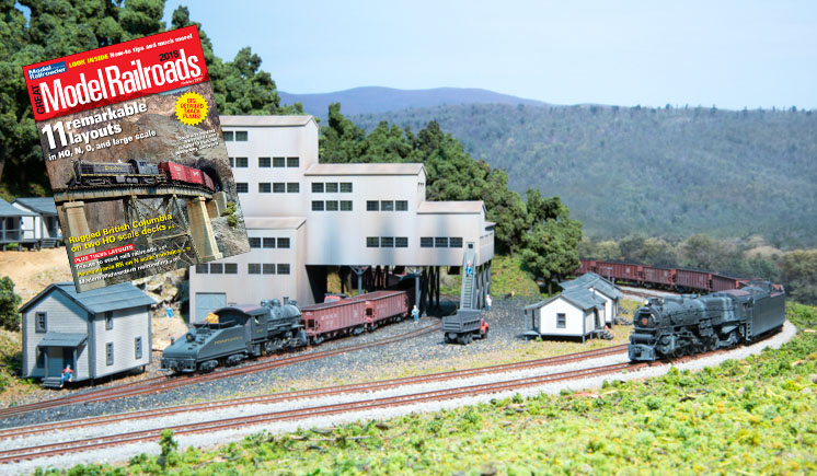 model train powered by a steam locomotive coming around a bend on a model railroad and the cover of Great Model Railroads 2018