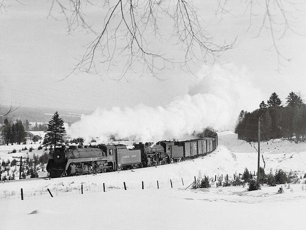 Canadian Pacific 2-8-2s travel along the Eaton River valley