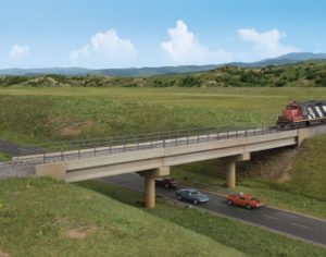 Concrete bridge over road with cars