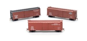 Three sheathed boxcars