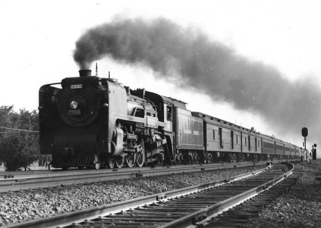 Canadian Pacific 4-6-2 steam locomotive with long passenger train