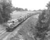Four diesel locomotives hauling a freight train.