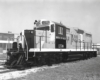 An oblique front view of a mid-century diesel locomotive.