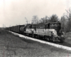 Three Toronto, Hamilton & Buffalo diesel locomotives with freight train.