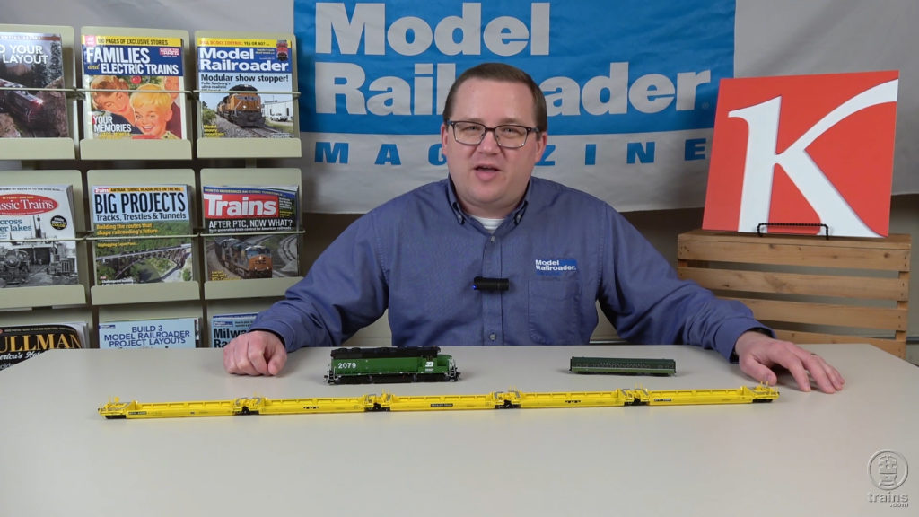 Cody Grivno with ScaleTrains.com HO scale Pullman-Standard/Trinity Backpacker 5-unit well car, RailSmith N scale lightweight coach in Northern Pacific green, and Athearn HO scale GP38-2 in BN green and black