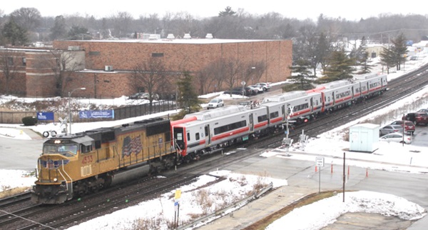 Train pulling line of cars